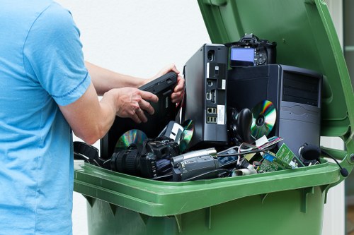 Workers sorting recyclable materials behind a theatre